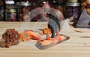 Aragonite Crystal With Incense and Stone Pyramid on Meditation Altar