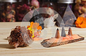 Aragonite Crystal With Incense and Stone Pyramid on Meditation Altar