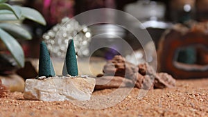 Aragonite Crystals With Incense Cones on Australian Red Sand