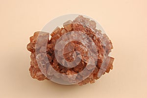 Aragonite-raw on a Pink Background.