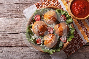 Arancini rice balls stuffed with meat and sauce. horizontal top photo