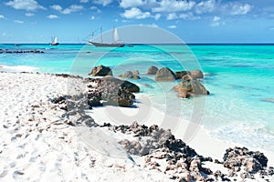 Arashi Beach Aruba Caribbean Sea sand rocks crystal clear turquoise water boats photo