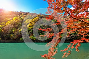 Arashiyama in autumn season along the river in Kyoto, Japan