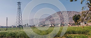 Aravalli Hill Range at Rajathan, India with green agricultural field