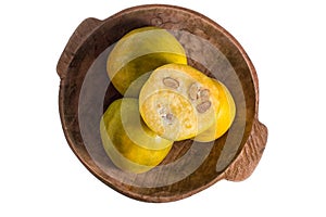 Araza fruit in wood bowl