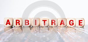ARBITRAGE word made with building blocks, concept