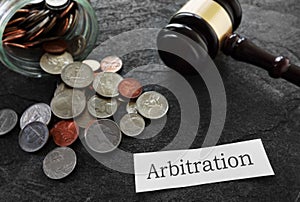 Arbitration news headline with coins and gavel