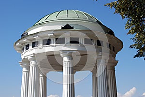 Arbor decorated by white columns.