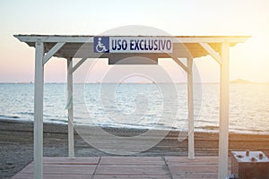 Arbor for Wheelchair user exclusive use at Los Narejos beach in Spain. Places in the Beach for people with disabilitiesthe sign is