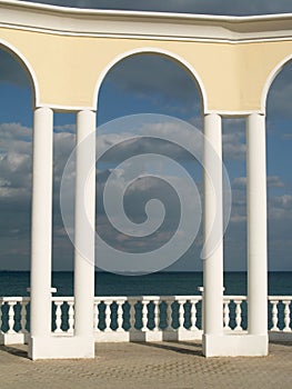 Arc, balustrade and sea photo