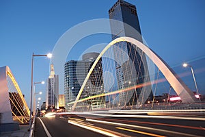 Arc bridge girder highway car light trails city night landscape