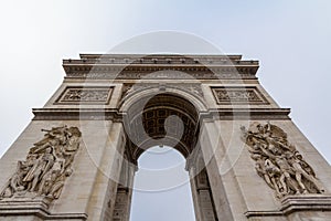 Arc de Triomphe Triumph Arch, or Triumphal Arch on place de l`Etoile in Paris, taken from below.