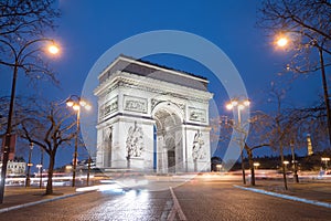 Arc de tTriomphe in Paris At Night photo