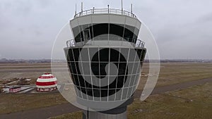 Arc shot of flights management air control tower in international airport