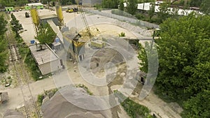 Arc shot of old concrete factory conveyor and nearby facilities