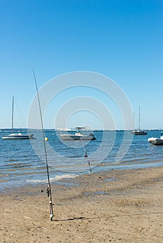 Arcachon Bay, France, fishing rods on the beach