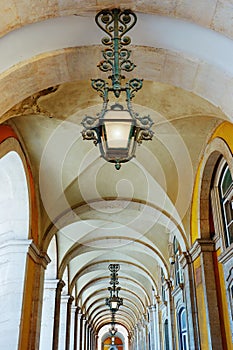 Arcade arches at Comercio square in Lisbon, Portugal.