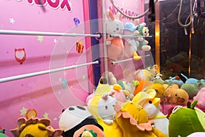 Close up to toys machine at shopping mall. Arcade claw machine toys crane game