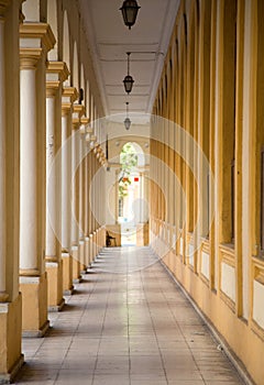 Arcade with yellow pillar in Cuba