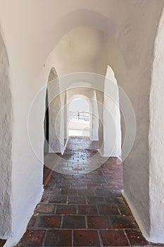 Arcades of a fishing village, Menorca, Spain