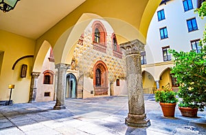 The arcades of the Palazzo Borromeo, leading the inner courtyard with medieval frescoes, Milan, Italy