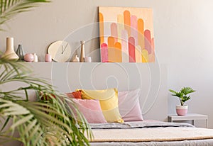 Arcades poster in real photo of grey bedroom interior with fresh