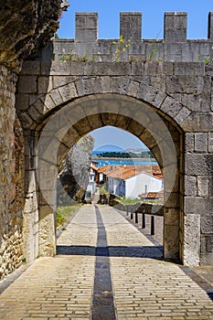 Arch access door to the medieval castle. San Vicente de la Barquera