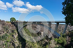 Arch bridge, road above the canyon landscape