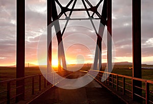 Arch bridge in sunset