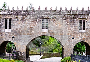 Arch of a castle in the middle of a Galician forest