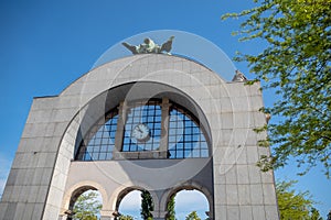 Arch with clock and statue on top for background