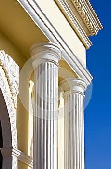 Arch columns under blue sky