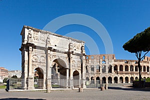 The Arch of Constantine Arco di Costantino. .Triumphal arch and Colosseum on background. Rome, photo