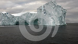 Arch of Darwin huge giant unique glacier iceberg in ocean of Antarctica.