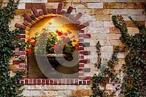 Arch with a decorative opening for stone flowerpot with flower.