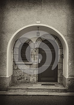 Arch door and wall in sepia