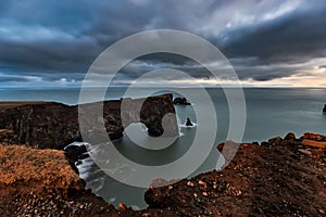 Arch at Dyrholaey in Iceland at sunset