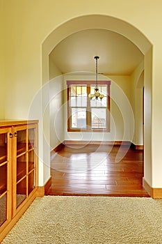 Arch with empty room and wood cabinet. New luxury home interior.