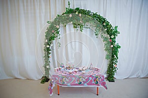 Arch with floral decorations . flower arch with flowers, branches and green leaves . design decoration elements with