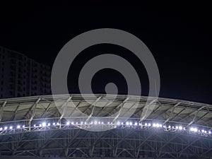 Arch of the football stadium. Football match lighting. Part of a sports facility. Sports complex engineering