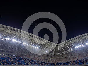 Arch of the football stadium. Football match lighting. Part of a sports facility. Sports complex engineering