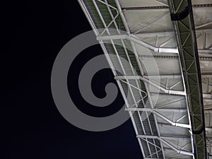Arch of the football stadium. Football match lighting. Part of a sports facility. Sports complex engineering