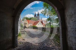 Arch gate to medieval Meissen old city with beautiful Albrechtsburg Castle in background. Dresden, Saxony, Germany. Sunny Day in