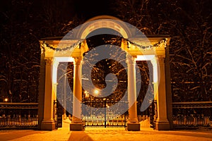 Arch With Gates And Illuminated In Park In Night In Winter In Kolomna, Moscow Region, Russia