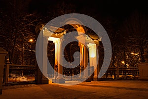 Arch With Gates And Illuminated In Park In Night In Winter In Kolomna, Moscow Region, Russia
