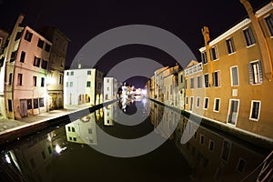 Arch on house and canal Vena. Chioggia photo