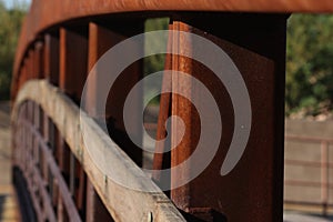 Arch of metal and wood bridge photo