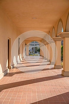 Arch passageway with arch pillars and red tiles at downtown Tucson, Arizona