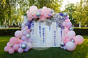 Arch of pink and purple balloons for girl happy birthday party.