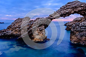 The Arch of Portitxol at the Mediterranean Sea Escala, Catalonia, Spain. photo